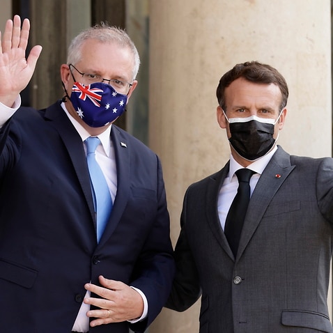 French President Emmanuel Macron greets Australian Prime Minister Scott Morrison upon his arrival at the Elysee Palace in Paris in June.