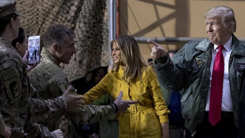 President Donald Trump and first lady Melania Trump greet US troops at an air base in Iraq.