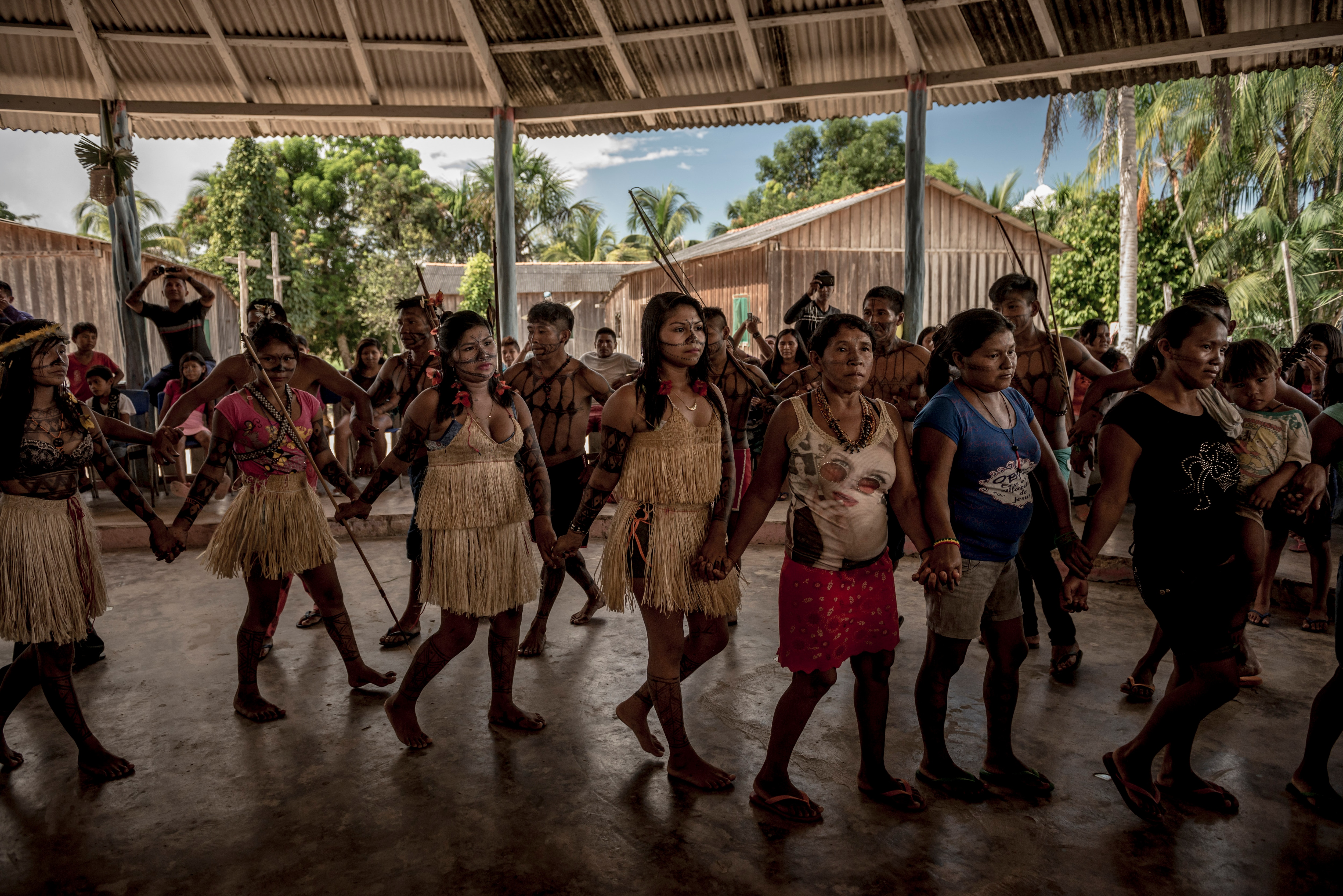 Members of the indigenous Munduruku tribe perform a traditional ceremonial dance at the start of a rare three-day assembly of Munduruku. Members of the indigenous Munduruku tribe perform a traditional ceremonial dance at the start of a rare three-day assembly of Munduruku from many villages in the Amazon rainforest in Brazil.