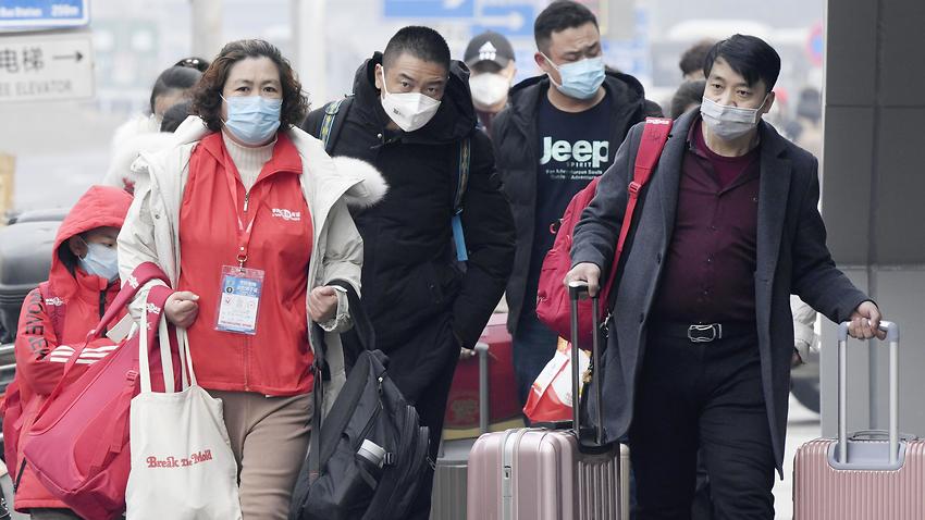 The death toll has neared 500. People wear masks.