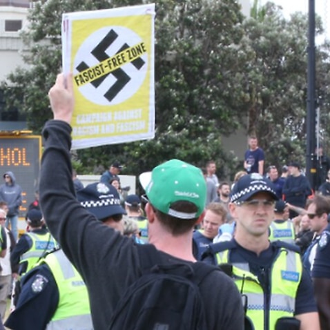 Police watch on as anti-fascist demonstrators gather near a far-right rally on St Kilda foreshore in January 2019.