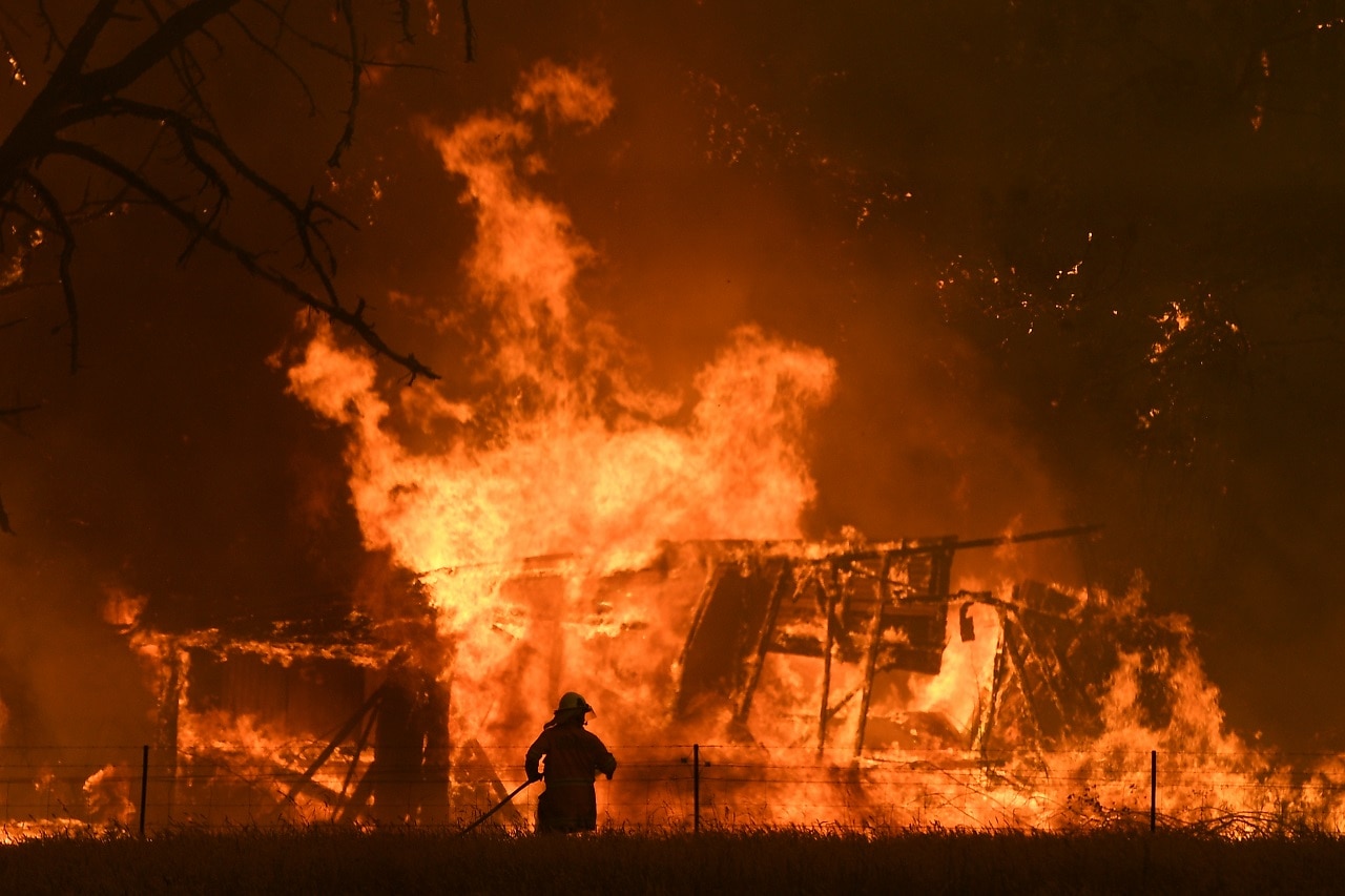 NSW Rural Fire Service crews fight the Gospers Mountain fire.