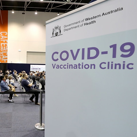 People waiting to receive their COVID-19 vaccination at a mass clinic in Perth