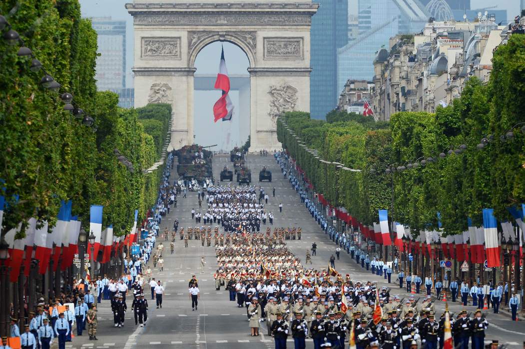 Troops march down the Champs-Elysees avenue during the annual Bastille Day military in Paris, on July 14, 2014. 