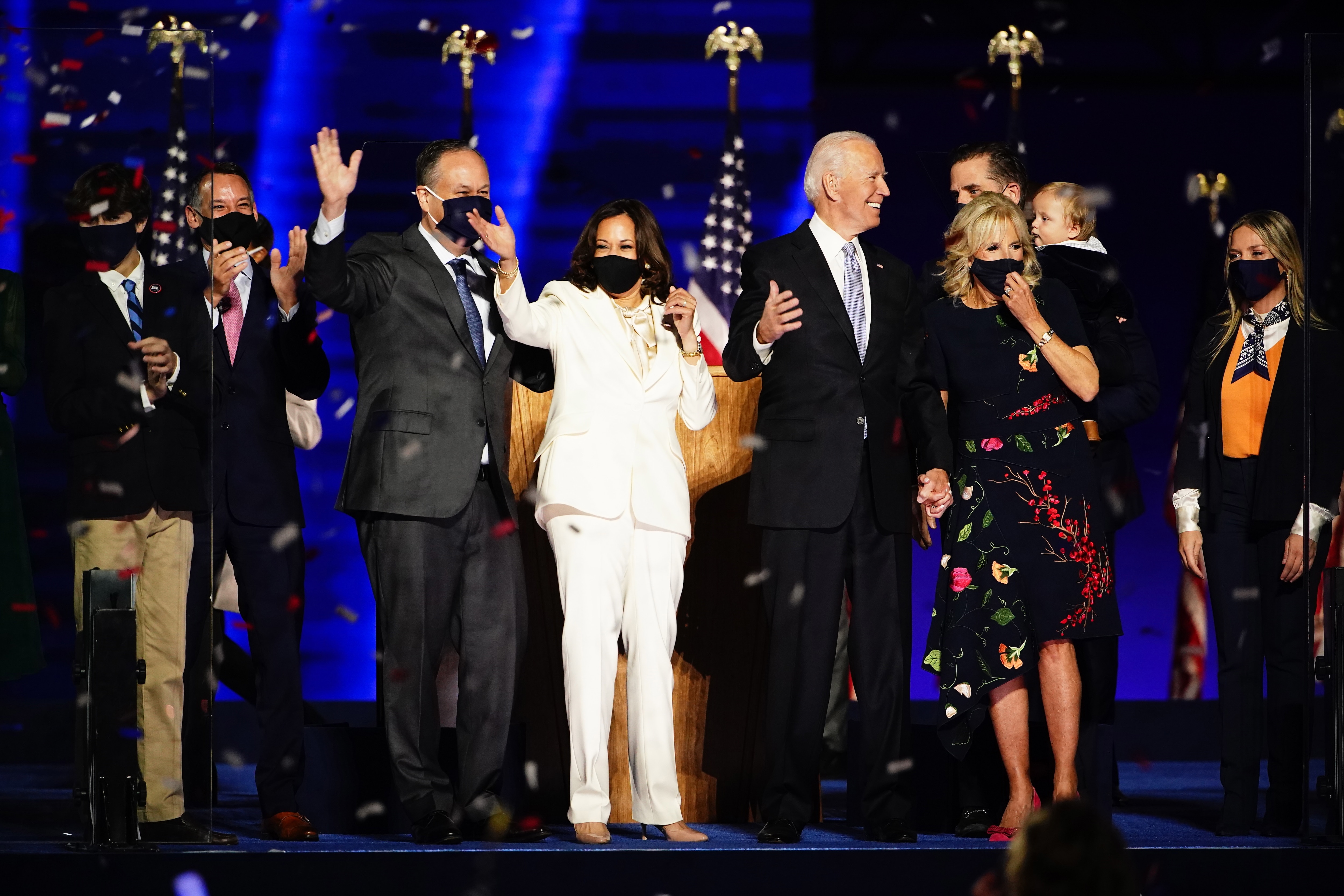 Joe Biden and Kamala Harris celebrate on stage with their families.