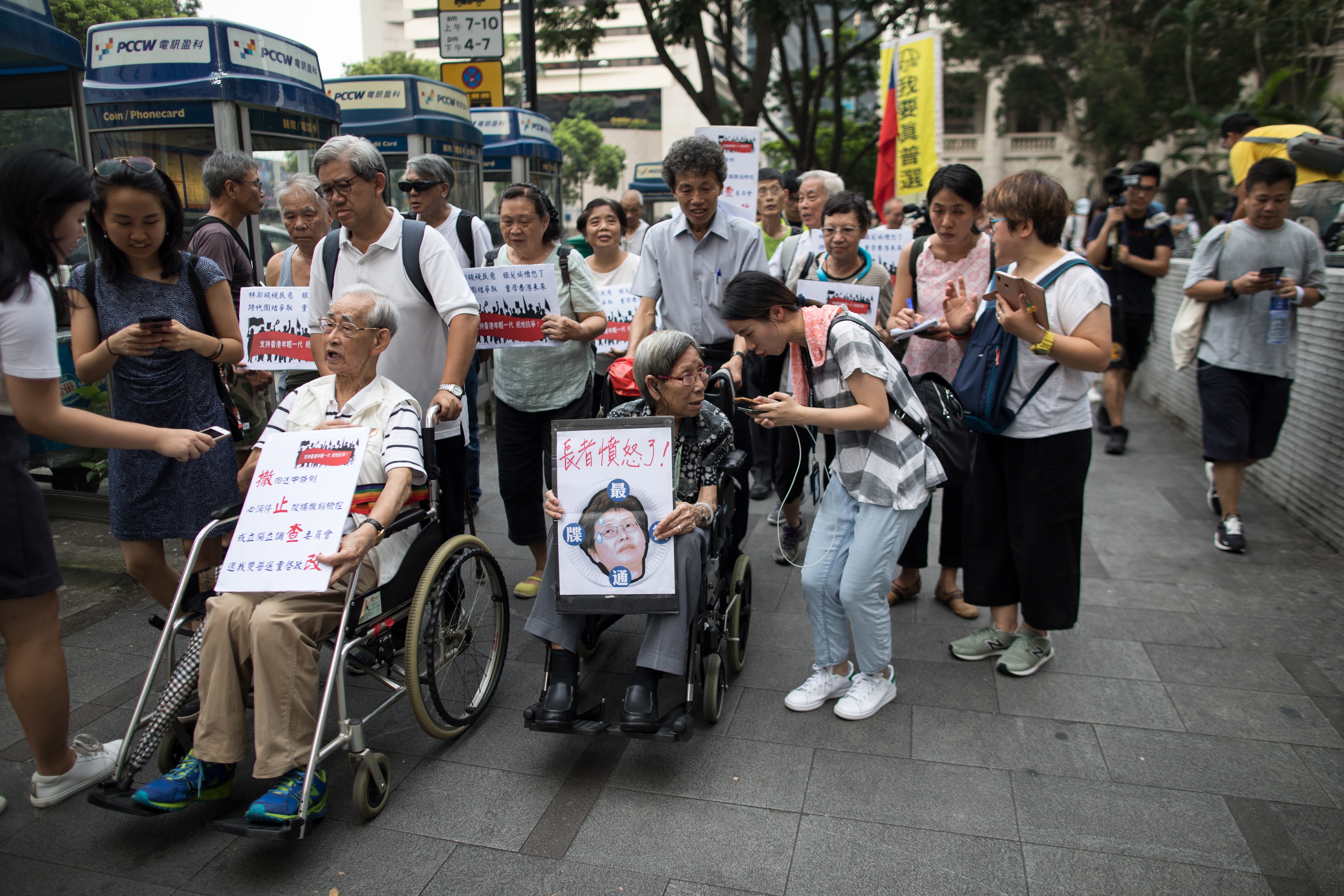 Hundreds of elderly people joined a silent march from the garden to the government's headquarters to call on the administration to address people's demands.