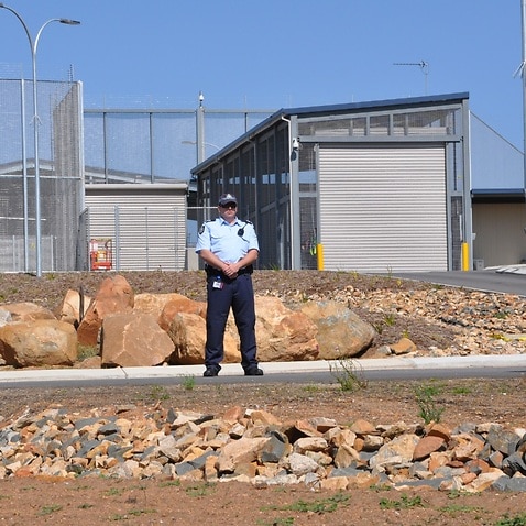 Federal police outside Yongah Hill Immigration Detention Centre where activists called for an end to mandatory imprisonment. Aug 26.