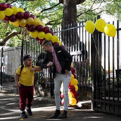 Staff welcome students back to school after COVID-19 restrictions were lifted, at Glebe Public School in Sydney