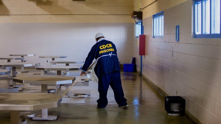 An inmate mops the floor at the Richard J. Donovan Correctional Facility in San Diego, California.