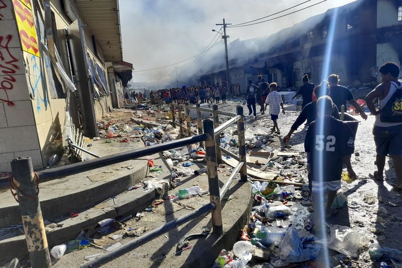 Looting and burning continued in Chinatown district of Honiara on the Solomon Islands on November 26, 2021