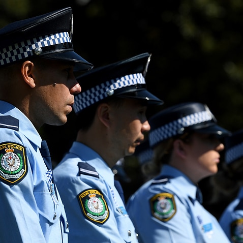 NSW Police stand at attention during a service to honour fallen members of the NSW Police Force in Sydney Friday, September 28, 2018. (AAP Image/Joel Carrett) NO ARCHIVING