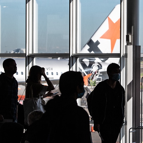 Passengers waiting to board a Jetstar flight at Sydney Airport, Sydney, Friday, 19 June, 2020. 