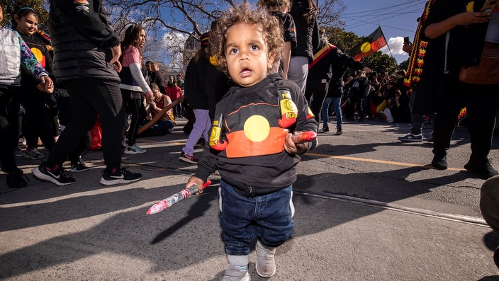 Brian Liddle Jr participates in a NAIDOC week march in Melbourne, Friday, July 6, 2018. Victorians hit the streets of Melbourne to celebrate the culture and achievements of Aboriginal and Torres Strait Islander people and mark the start of NAIDOC Week. (A
