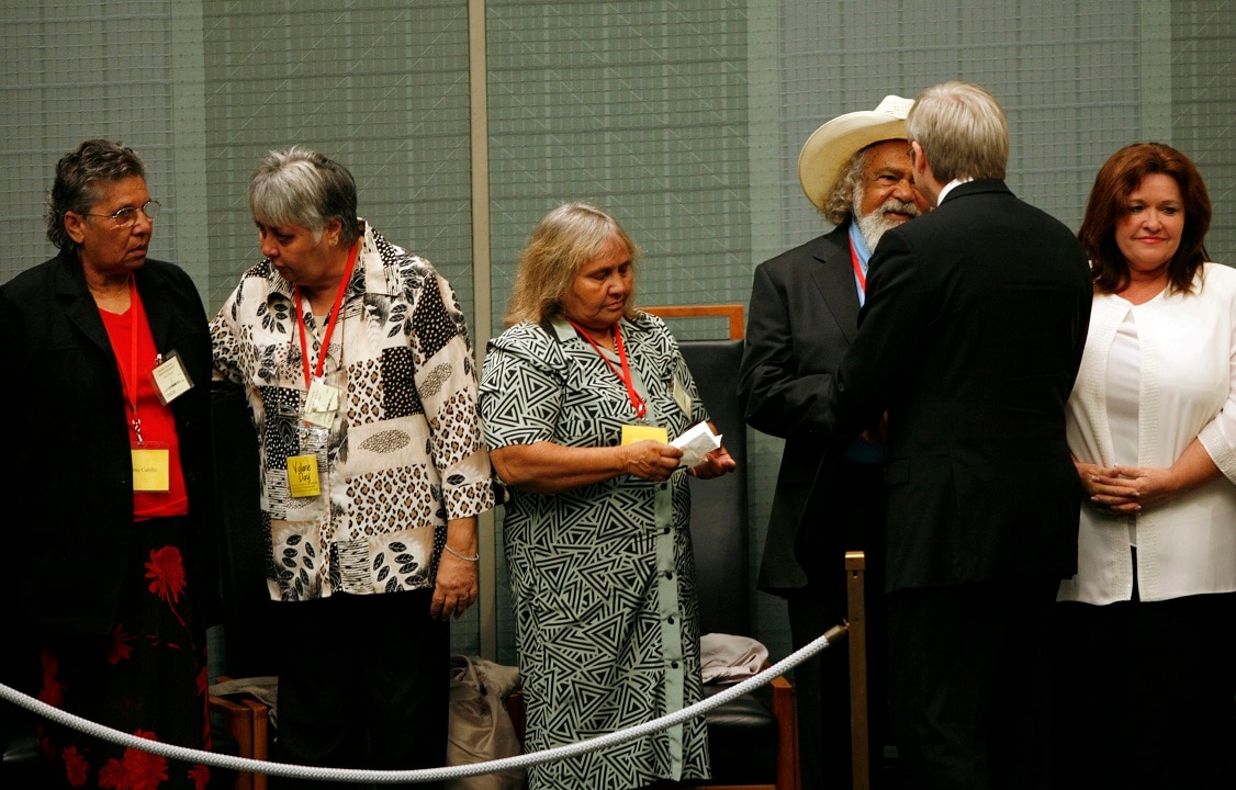February 13, 2008: Kevin Rudd greets Indigenous representatives in the House of Representatives Chamber after delivering the apology to the stolen generation.