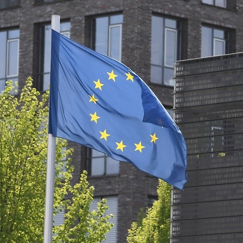 The Australian flag and the flag of the European Union are seen during an event at the German Ministry of Defence in Berlin, Sunday, April 22, 2018.
