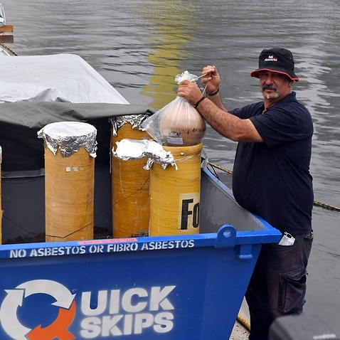 Fireworks Director Fortunato Foti holds a firework at a media event previewing preparations for the New Year's Eve fireworks display, Sydney, Wednesday, December 29, 2021. (AAP Image/Mick Tsikas) NO ARCHIVING