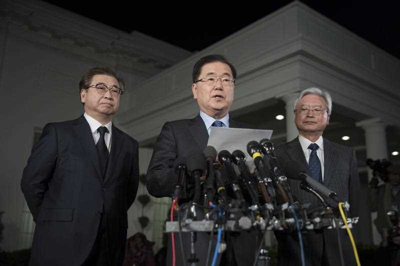 South Korean National Security Director Chung Eui-yong (C) makes a statement regarding his 07 March meeting with North Korean le