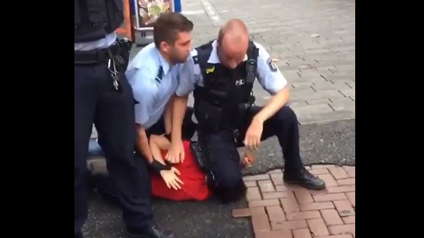 Outrage In Germany Over Incomprehensible Video Of Policeman Kneeling