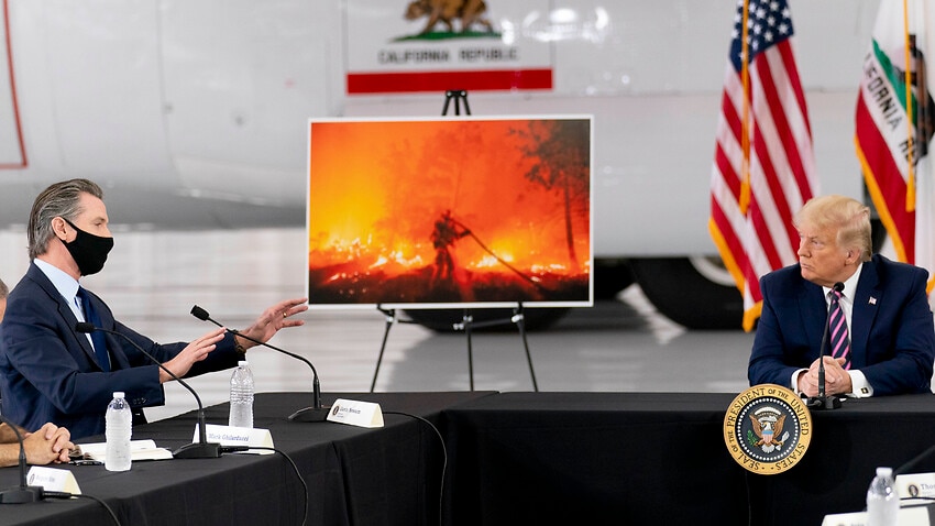 Donald Trump participates in a briefing on wildfires with California Governor Gavin Newsom, left, at Sacramento McClellan Airport, Monday, 14 September 2020.