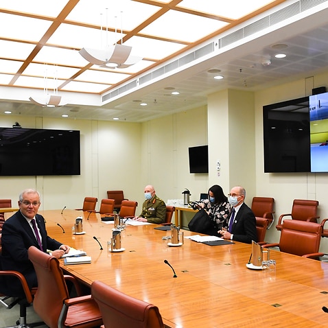 Prime Minister Scott Morrison, Australia’s Chief Medical Officer and COVID-19 Taskforce Commander attend a national cabinet meeting.