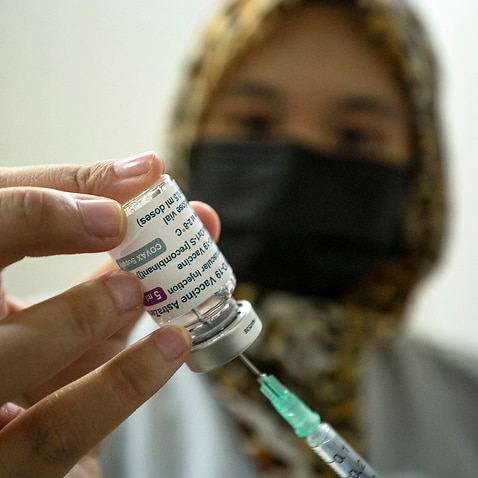 A medical officer prepares a dose of the AstraZeneca's COVID-19 vaccine in Kuala Lumpur, Malaysia, on 16 May, 2021. 