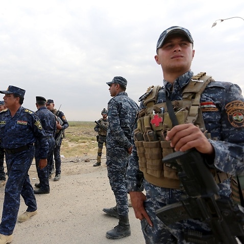Iraqi federal police forces take up position in Rashad town, southern Kirkuk.