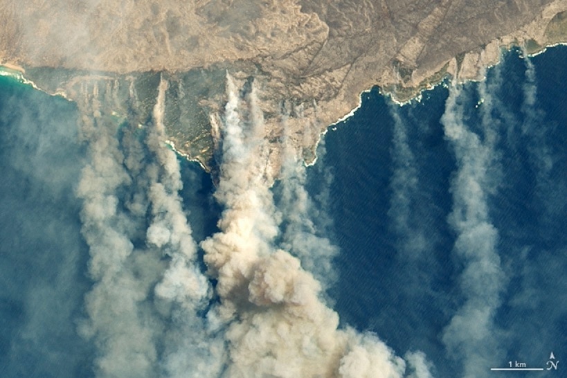 A satellite image showing burned land and thick smoke over Kangaroo Island, Australia on 9 January 2020. 