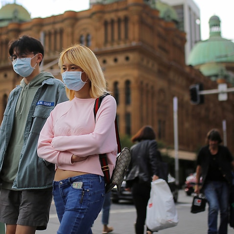 People wearing face masks as a preventative measure against coronavirus in Sydney