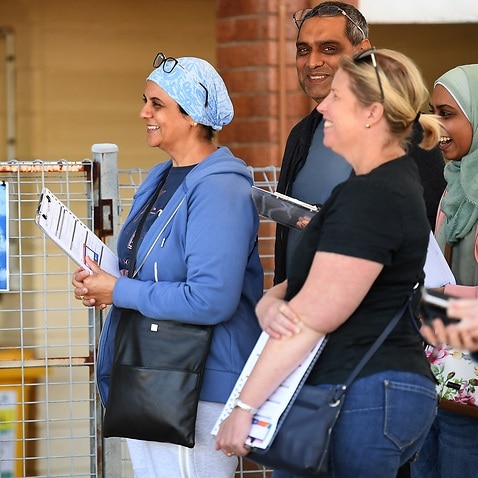 Queenslanders line up at a COVID-19 vaccination hub