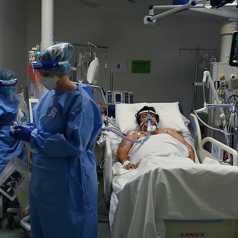 ICU staff caring for a COVID-19 patient at St Vincent’s Hospital in Sydney, Tuesday, July 13, 2021