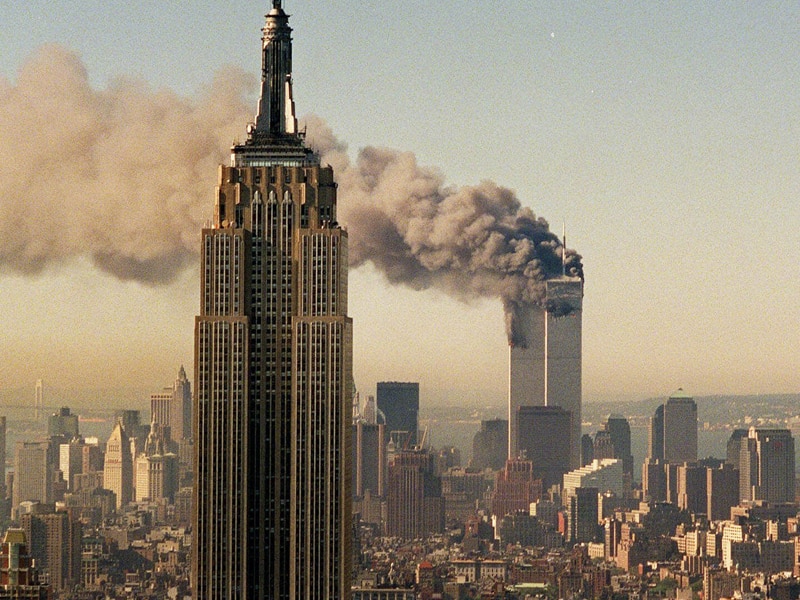 The twin towers of the World Trade Center burn in New York.