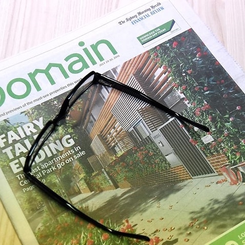 Fairfax's Domain real estate liftout is seen on a table in Sydney.