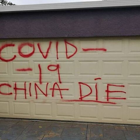 A racist message was spray-painted onto the family's garage door.