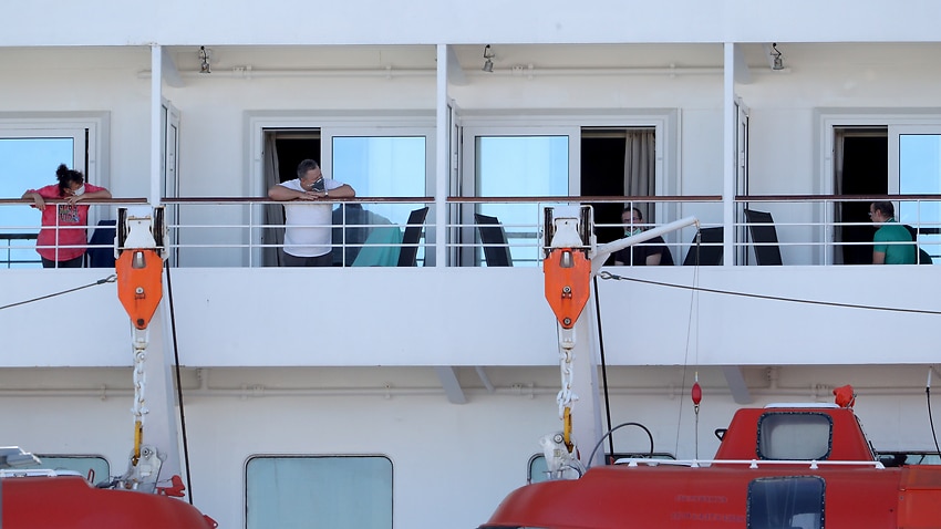 Crew members from the cruise ship Artania are seen isolating in their cabins in Fremantle, Monday, April 6, 2020