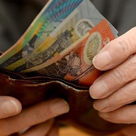 Money is taken out of a wallet Canberra, April 8, 2014.