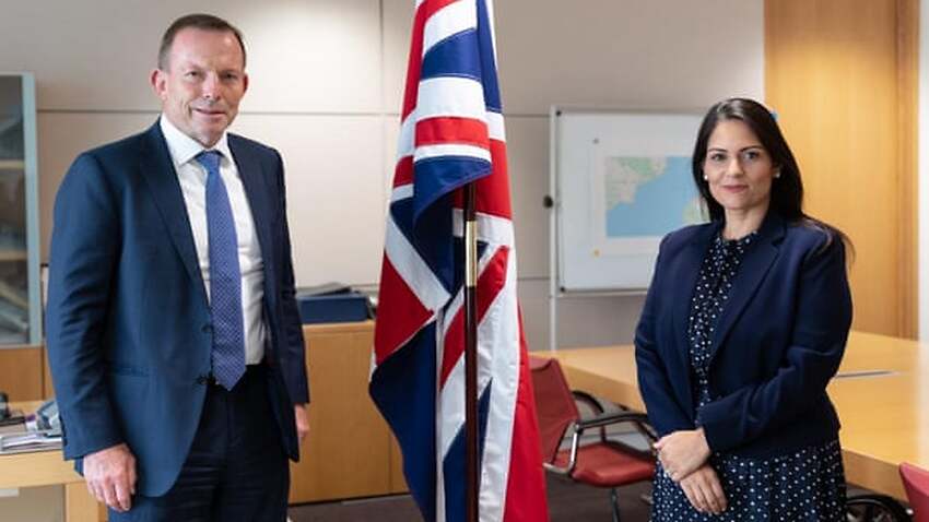 UK Home Secretary Priti Patel's (right) consideration of offshore processing is reportedly a sign of Tony Abbott's (left) influence.