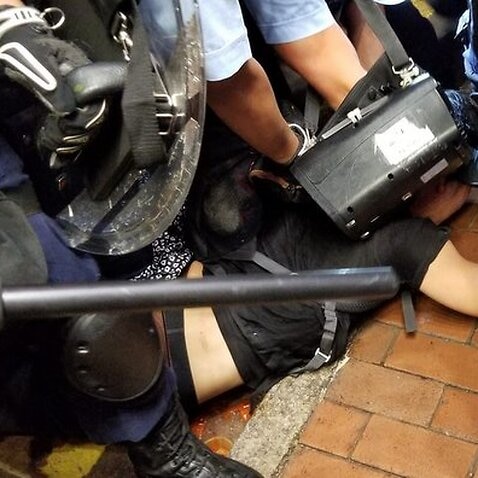 Hong Kong police accused of provoking protesters and failing to wear ID during Mong Kok chaos after extradition bill march.