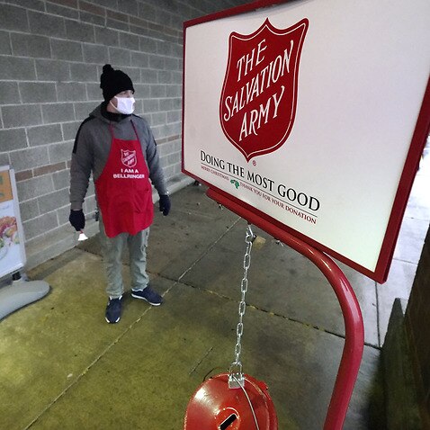 A Salvation army staff member at the charity’s donation kettle
