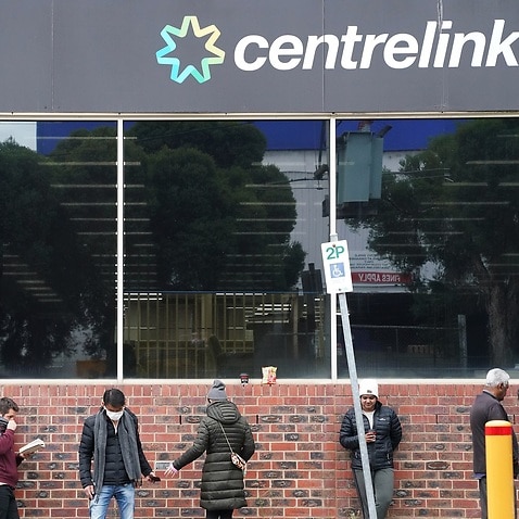 People queueing outside a Centrelink office in Melbourne.