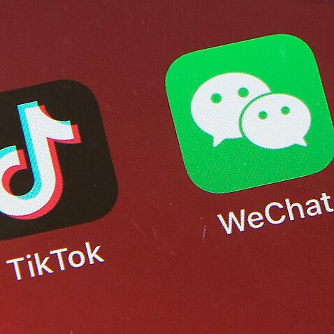 TikTok and WeChat on a smartphone screen