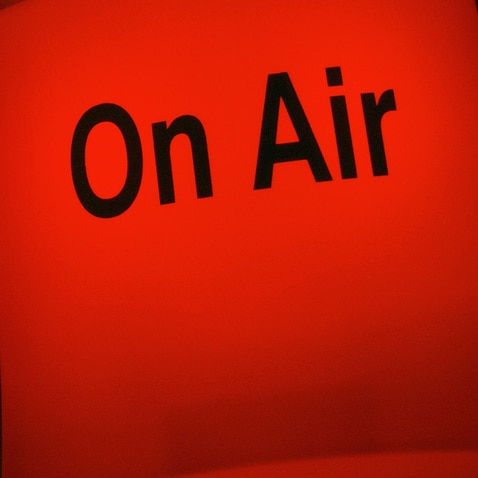 Red light sign outside the TV studio with the text On Air