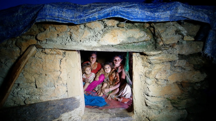  Pabitra Devi Jaisi (R), aged 29, and Sarada Jaisi (L), aged 30, share a tiny community 'Chapuadi' hut with their children at Ma