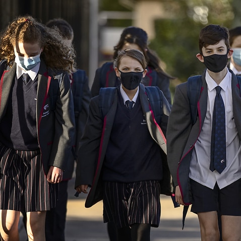 Bentleigh Secondary College students are seen returning to school as COVID-19 restrictions are eased across Victoria, in Melbourne, Wednesday, July 28, 2021.  (AAP Image/Daniel Pockett) NO ARCHIVING