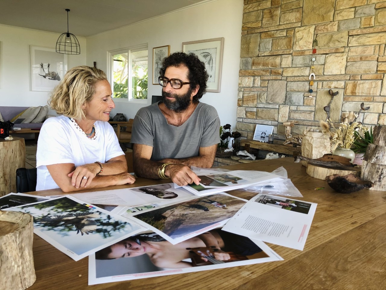 Sam and Cam Bloom at their living room table reminiscing.