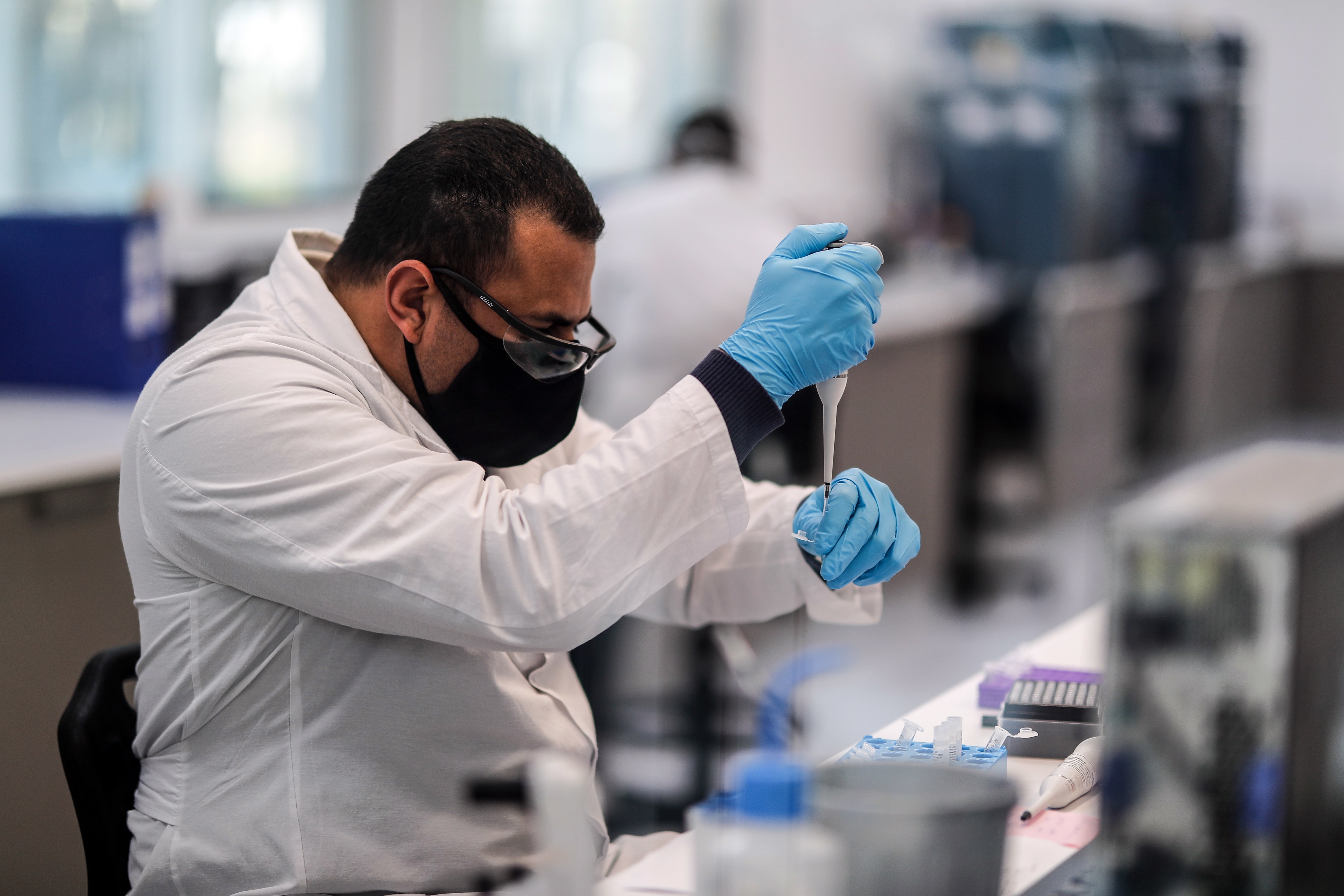 Workers of the mAbxience laboratory, chosen by AstraZeneca for the production in Latin America of the Oxford vaccine against COVID-19 carry out testing.