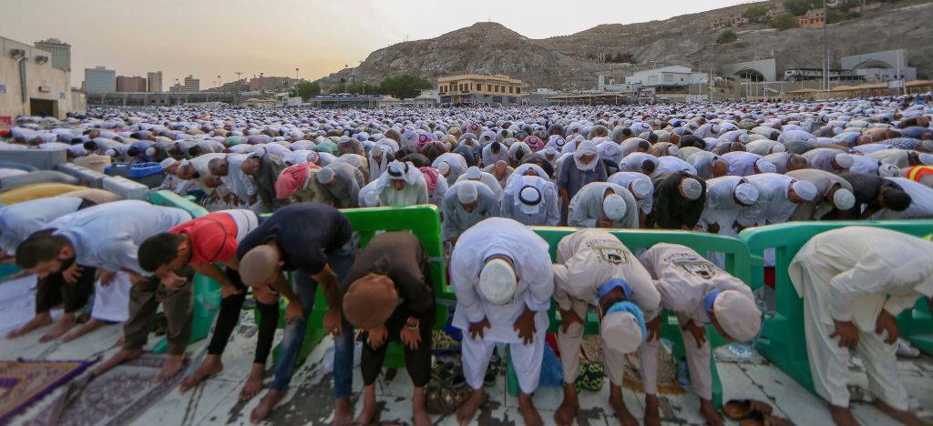 Muslim worshippers perform Eid al-Fitr prayers at the Grand Mosque in the Saudi holy city of Mecca in 2019