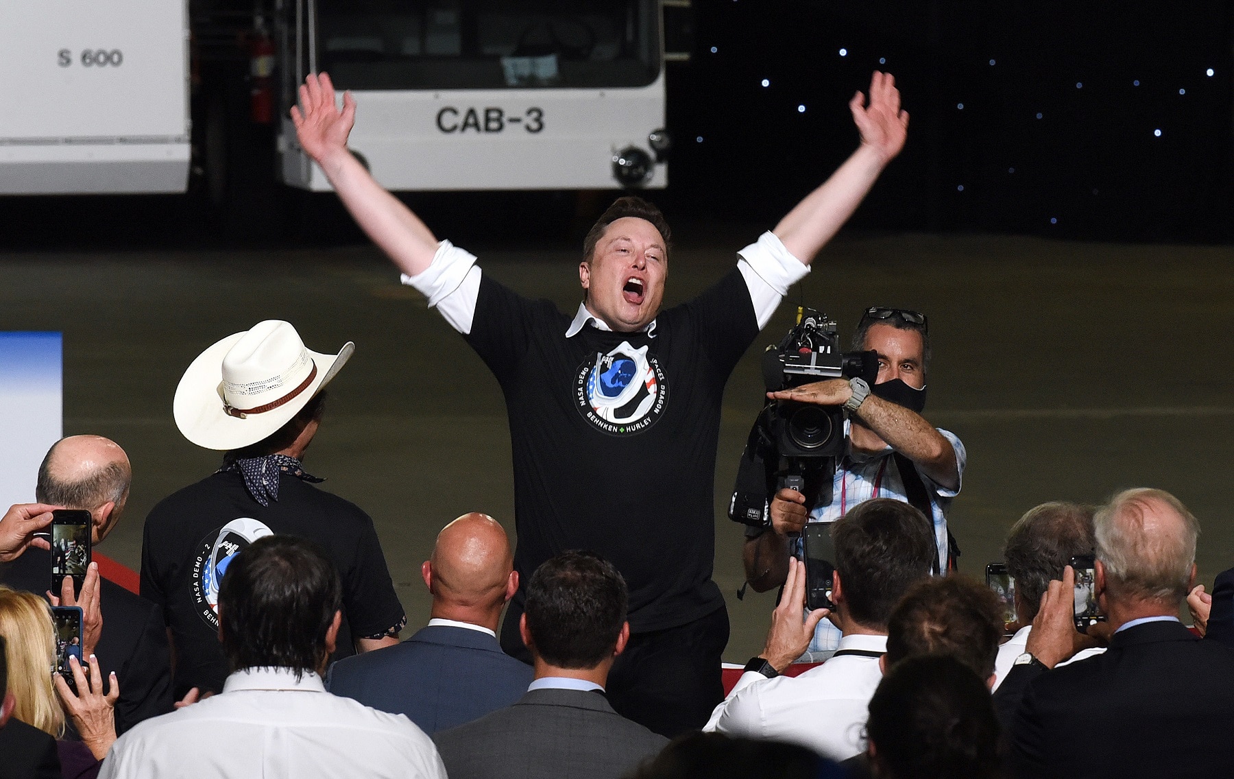 SpaceX CEO Elon Musk celebrates the successful launch of a Falcon 9 rocket with the Crew Dragon spacecraft.