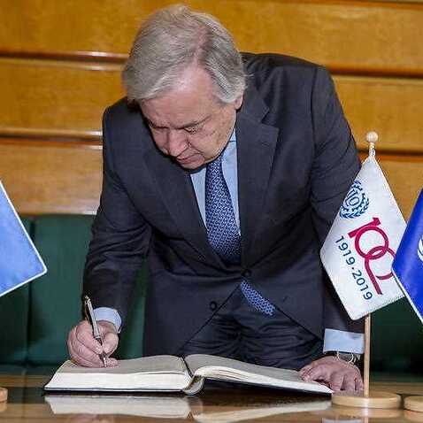 UN Secretary-General Antonio Guterres  signs the guest book before the 108th closing session of the International Labour Conference Centenary Session, at the European headquarters of the United Nations in Geneva.