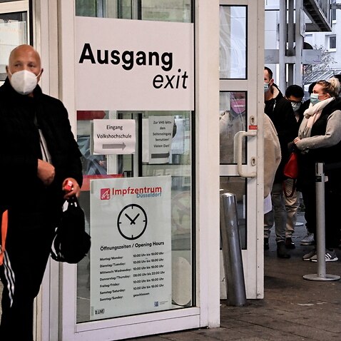 People queue for Covid-19 coronavirus vaccination at the main station vaccination center in Duesseldorf, Germany, 23 November 2021. 