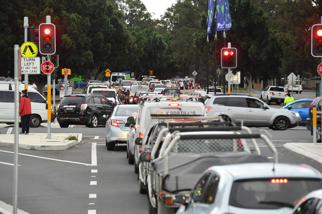 Long queues of cars are seen at a pop up COVID testing clinic at the Fairfield Showgrounds in Sydney. 